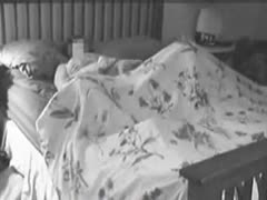 An oversexed wife is seen masturbating and toying her pussy on a hidden camera.
